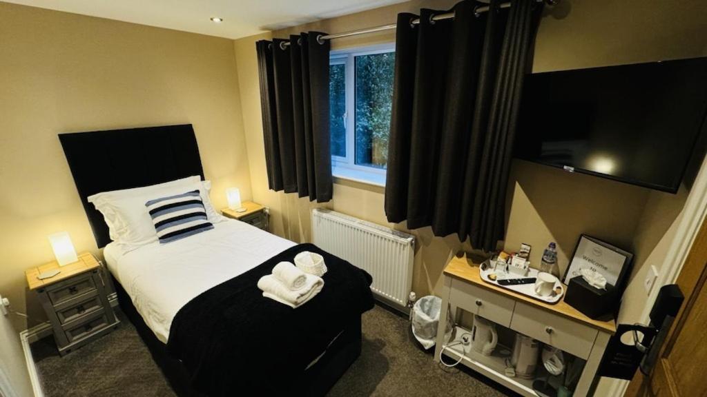 Deluxe Single Room,1395025883:JPEG