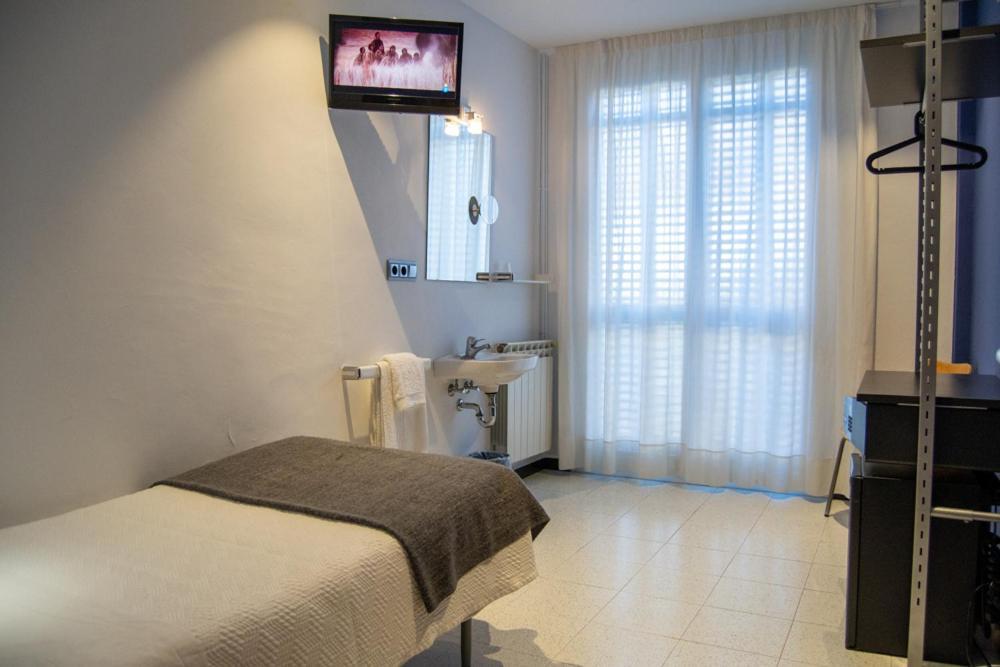 Quarto Individual com Casa de Banho Partilhada